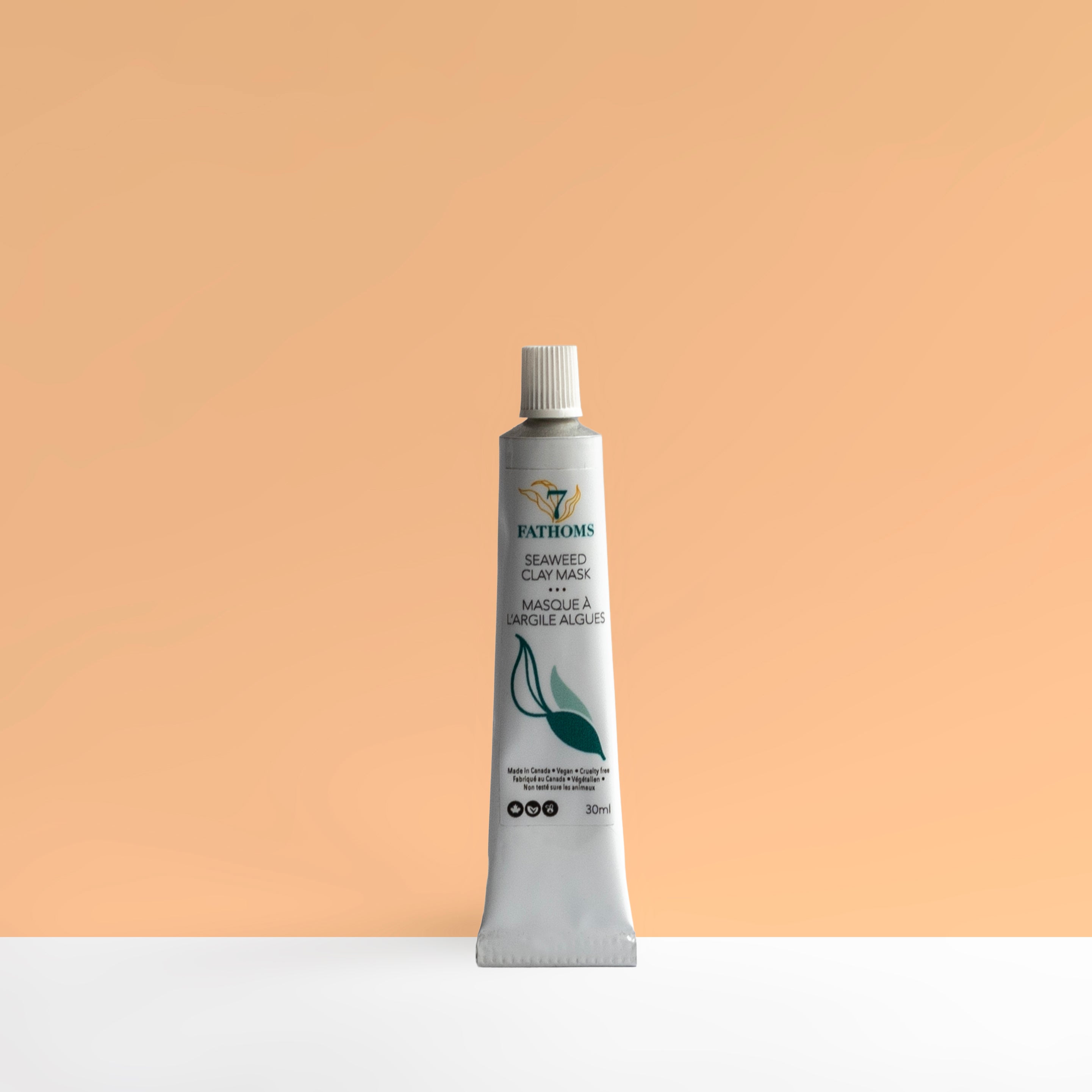 7 Fathoms seaweed clay mask tube on a peach background.