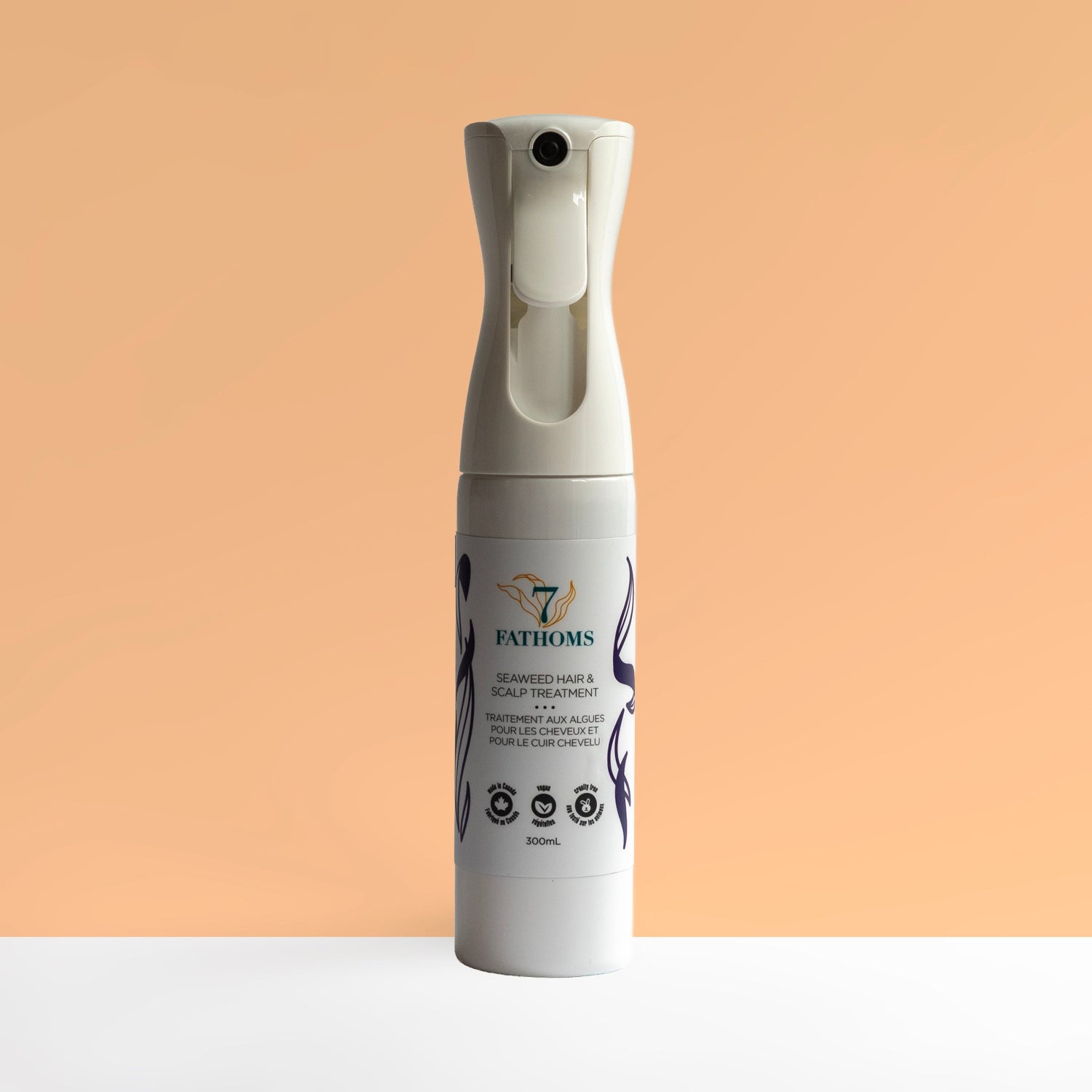 7 Fathoms large spray bottle with branding on a peach background