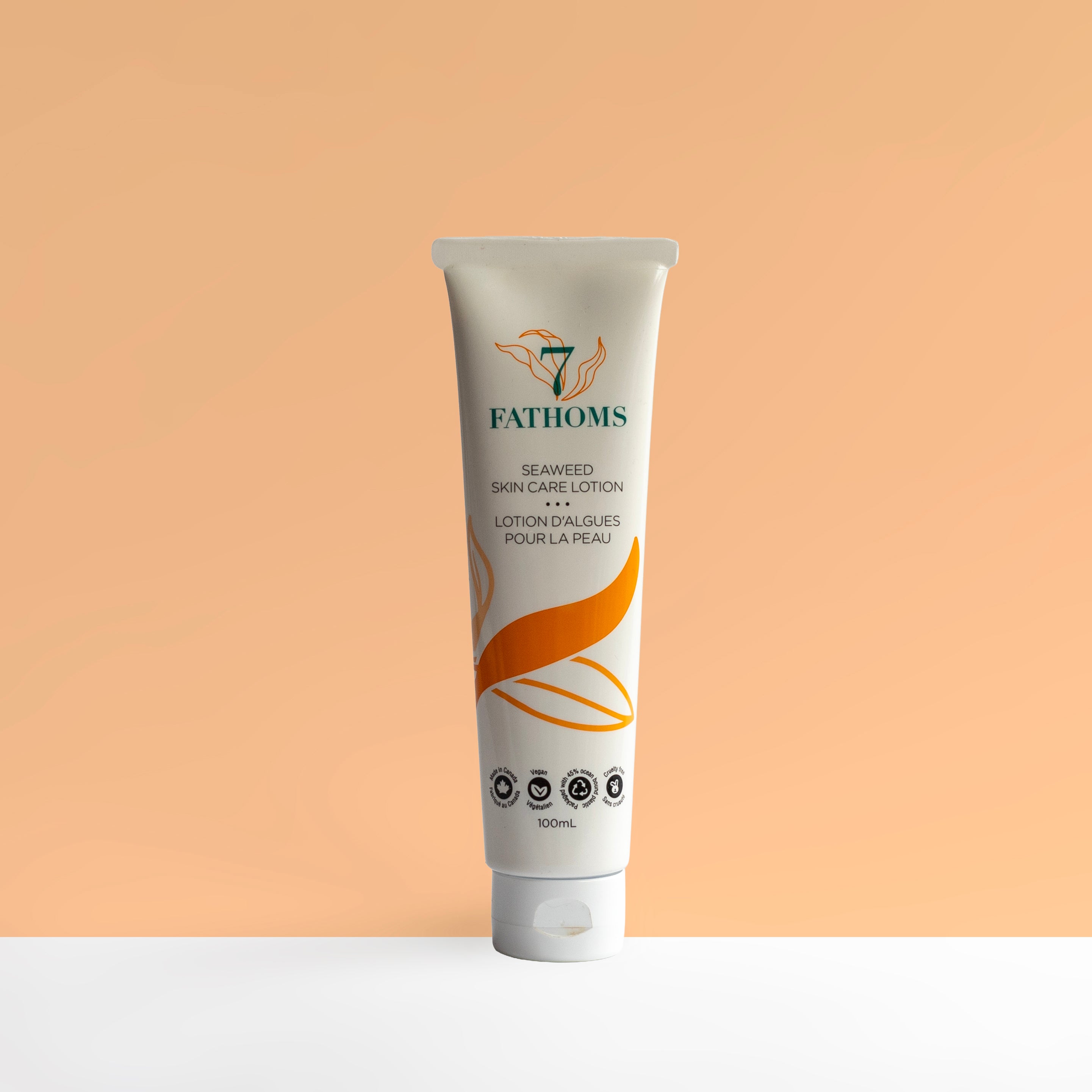 7 Fathoms Seaweed skin care lotion tube on a peach background