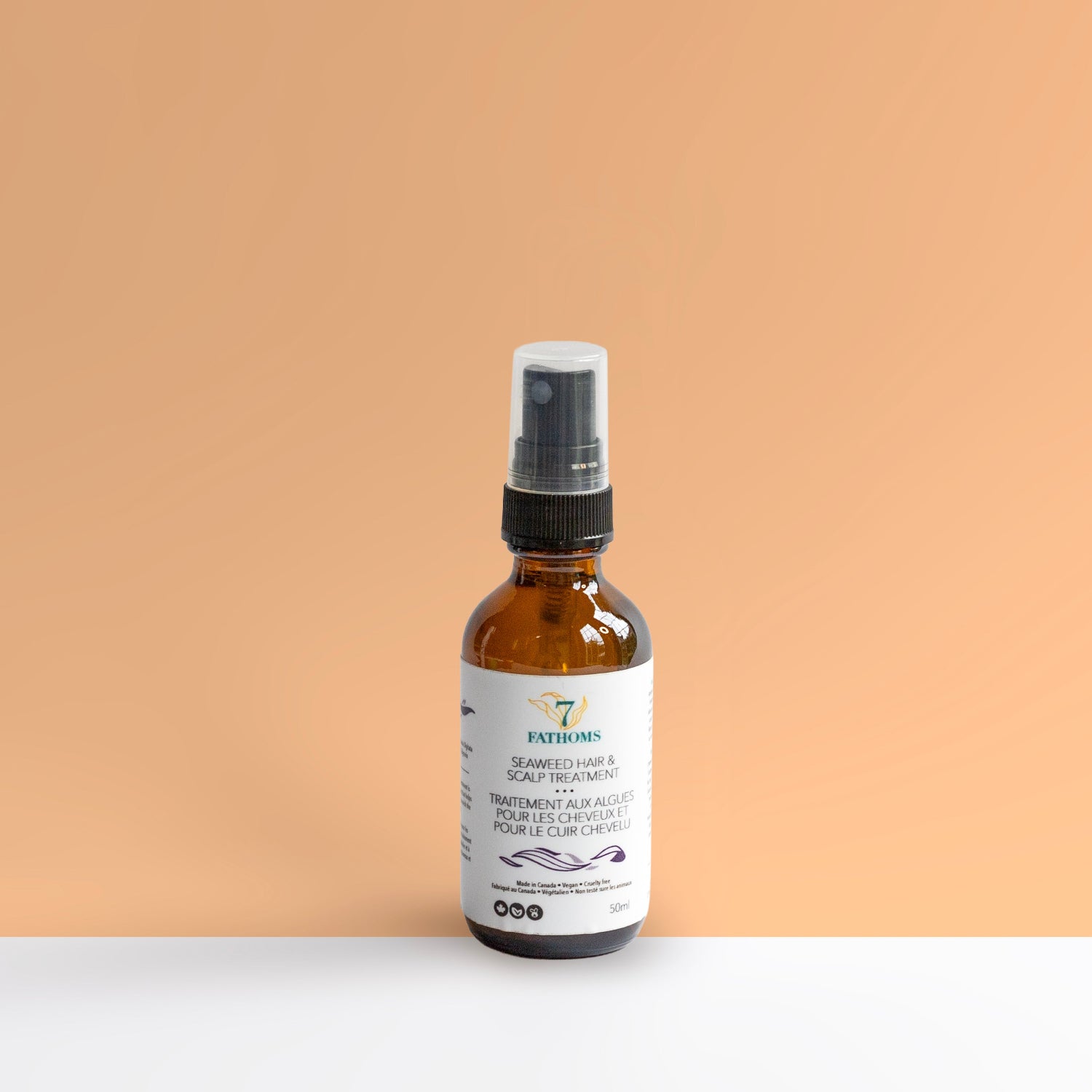 Bottle of Pathoms skincare product on a peach background