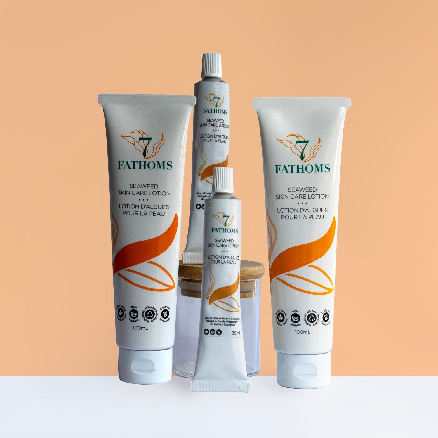 7 Fathoms seaweed skin care lotion tubes on a peach background